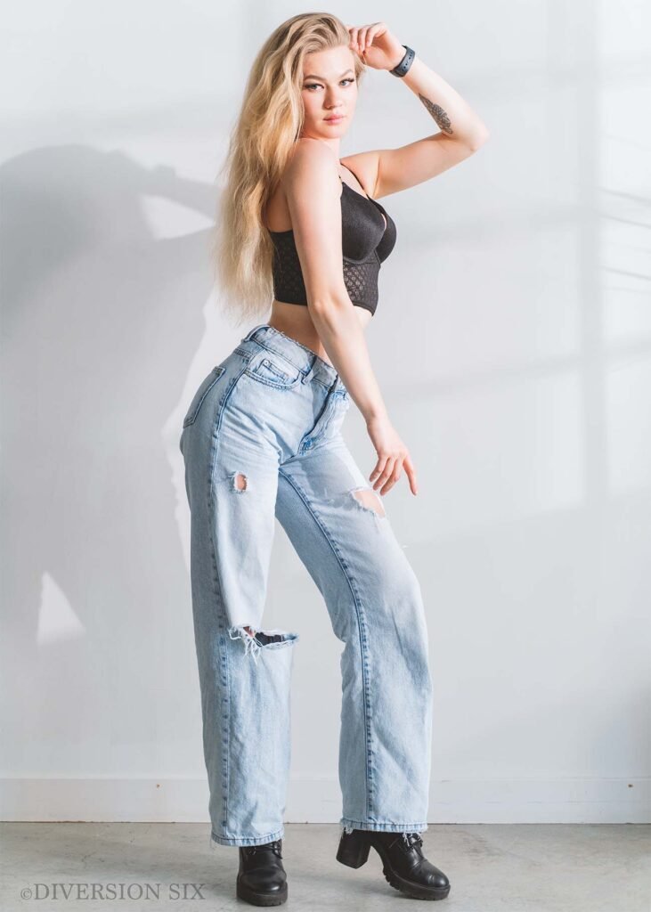 Blonde lingerie model wearing a corset